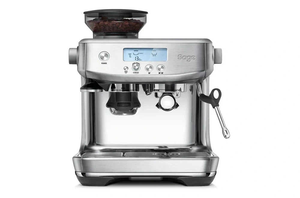Front view of the Sage espresso machine in polished silver finish, highlighting the side steam knob, dual boiler, and stainless steel design.