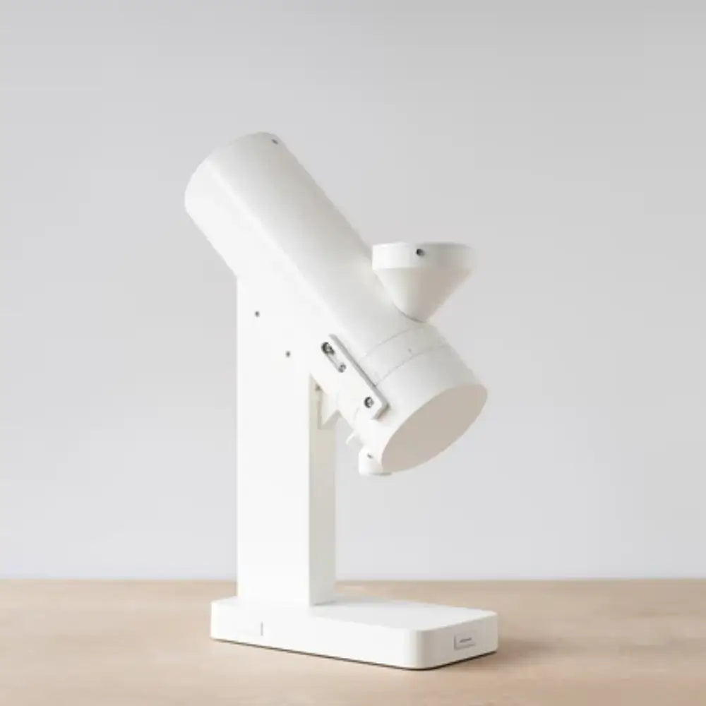 Acaia Orbit Coffee Grinder in matte white finish shown from the side profile