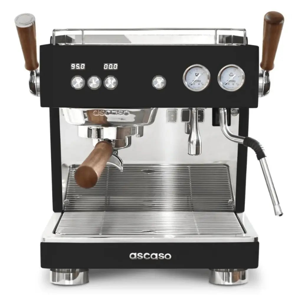 Front view of the Ascaso Baby T Plus espresso machine with wooden handles, dual gauges, and polished metal finish, ideal for professional coffee setups.