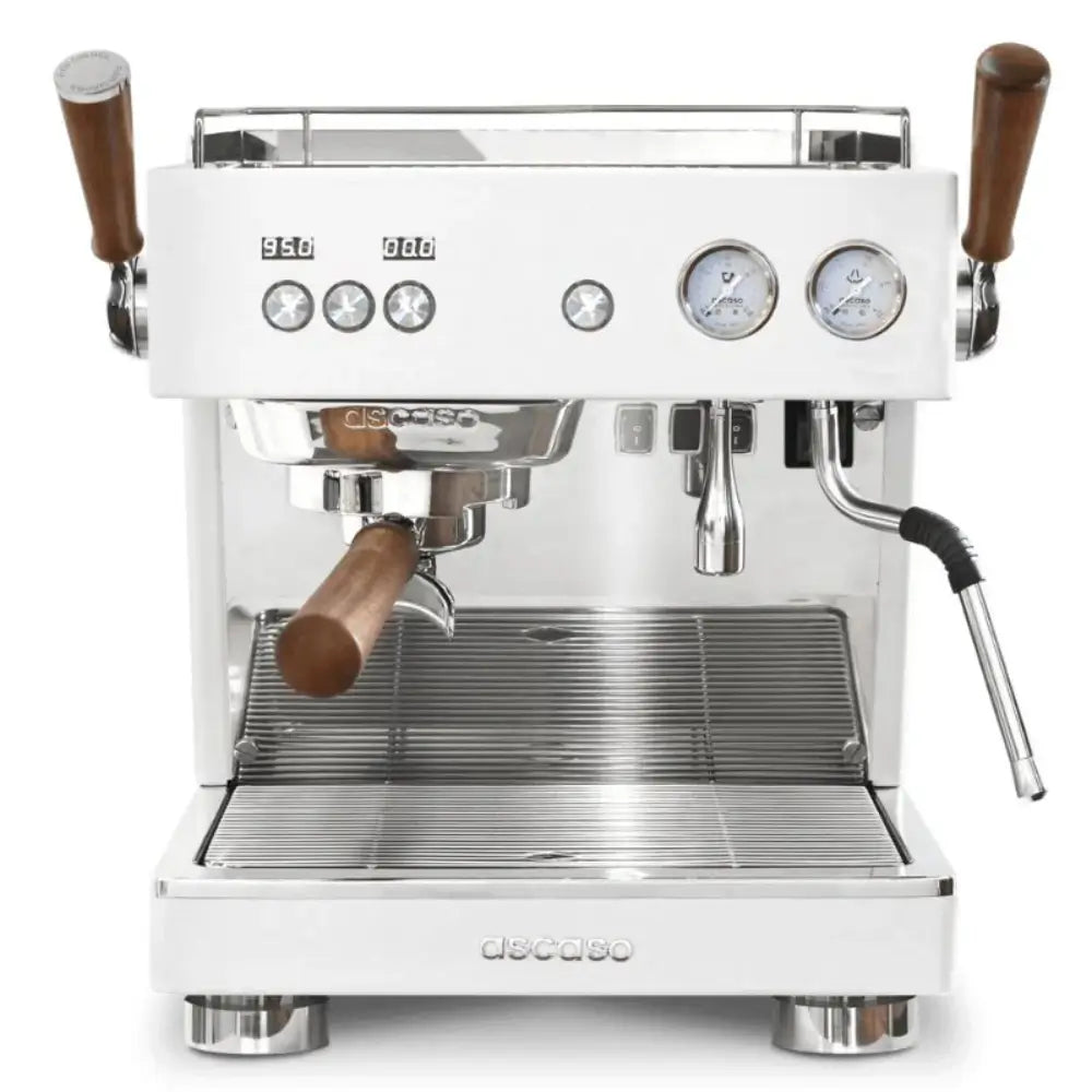 Front view of the Ascaso Baby T Plus espresso machine in white with wooden handles, dual gauges, and polished metal finish, ideal for professional coffee setups.