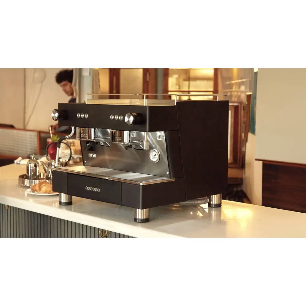 Angled view of the Ascaso BAR 2 Group espresso machine on a café counter.
