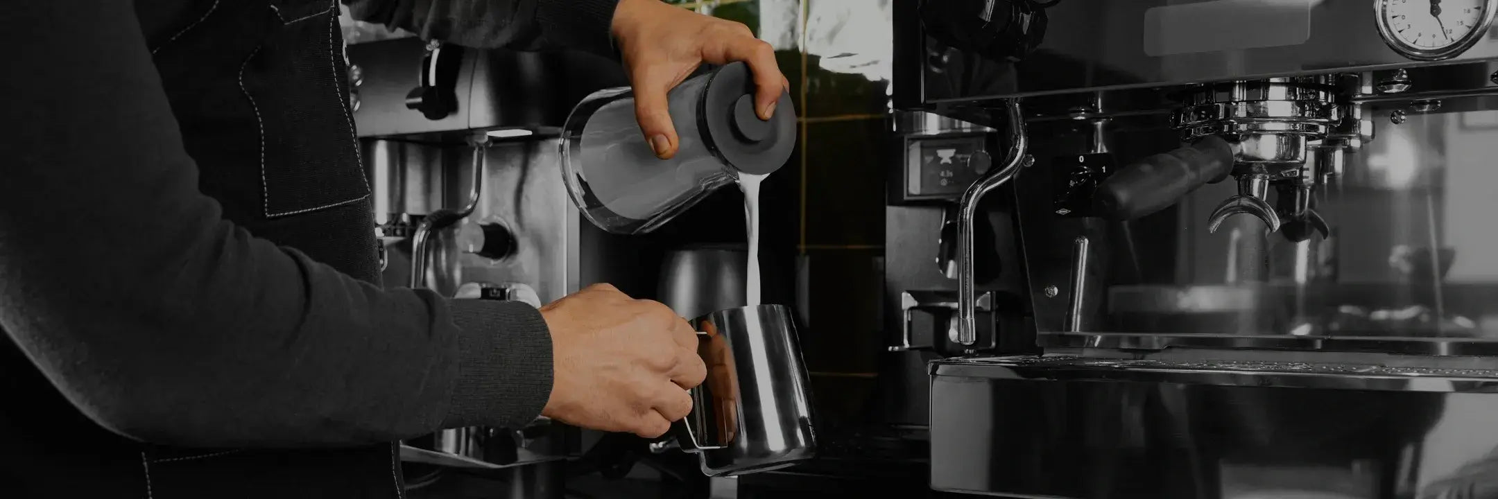 Person making coffee using a traditional espresso machine.