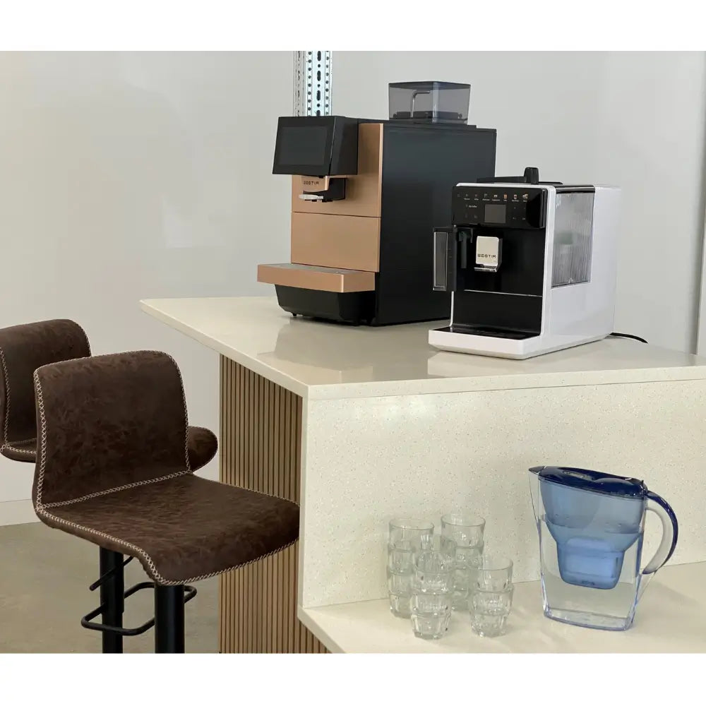 Bestir BM50 and compact Bestir coffee machines on office counter with bar stools.