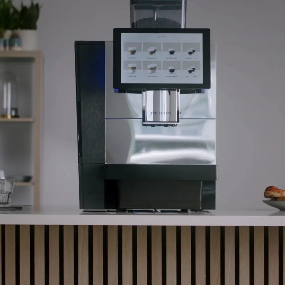 Front view of Bestir BM80 bean-to-cup coffee machine with chrome finish.