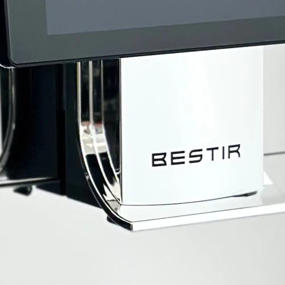 Close-up of Bestir BM80 coffee machine dispenser with brand logo in chrome.