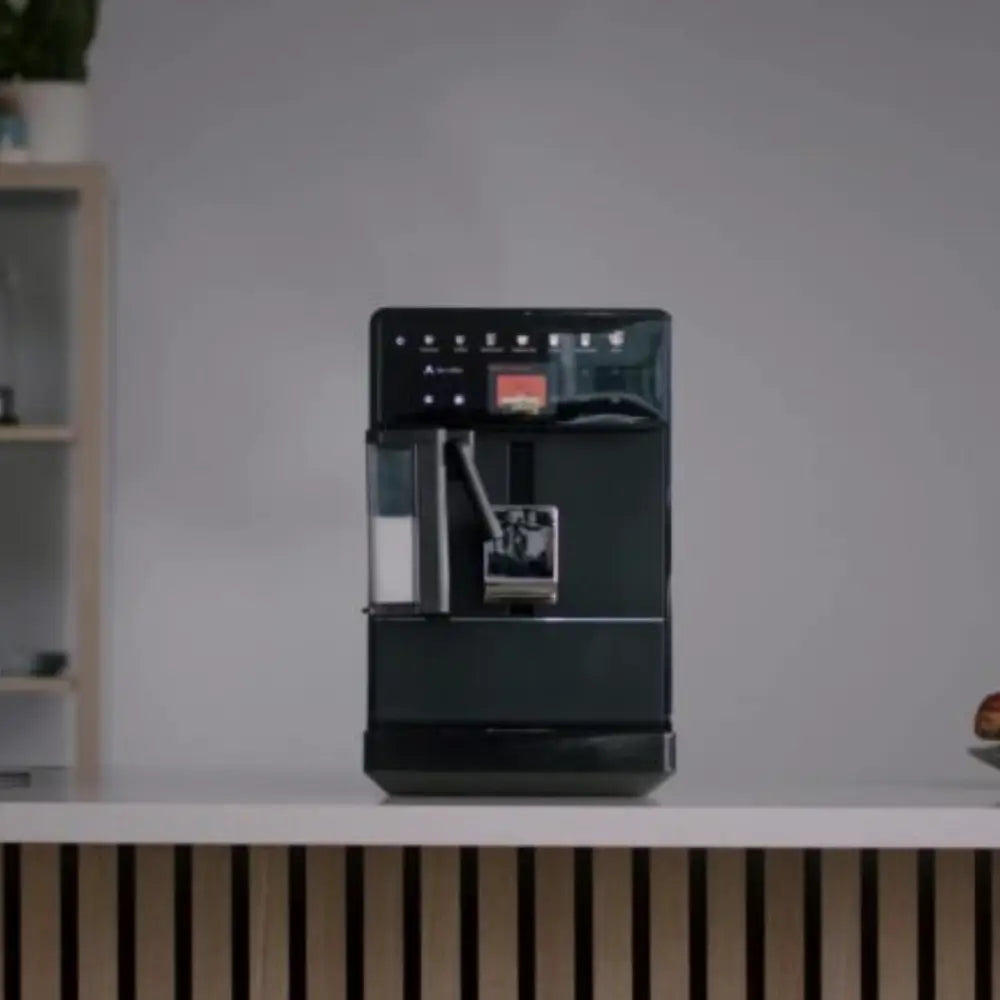 Front view of Bestir Melange coffee machine on counter with modern background.