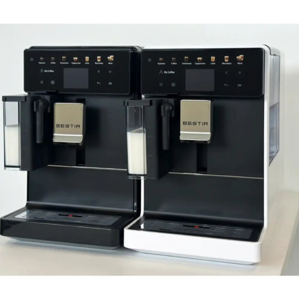 Black and white Bestir Melange coffee machines side by side with milk containers.