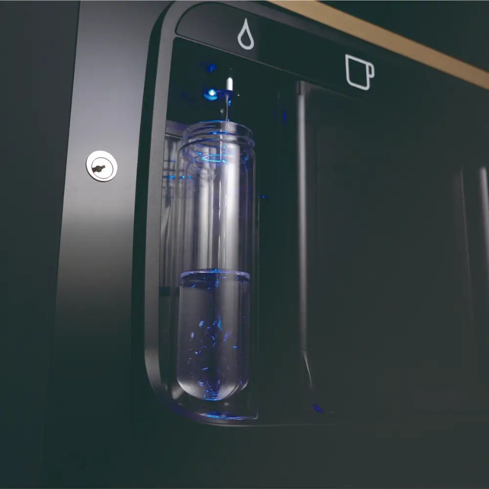 Close-up of the Coffetek Neo Q dispense bay filling a reusable water bottle with filtered water, promoting plastic reduction.