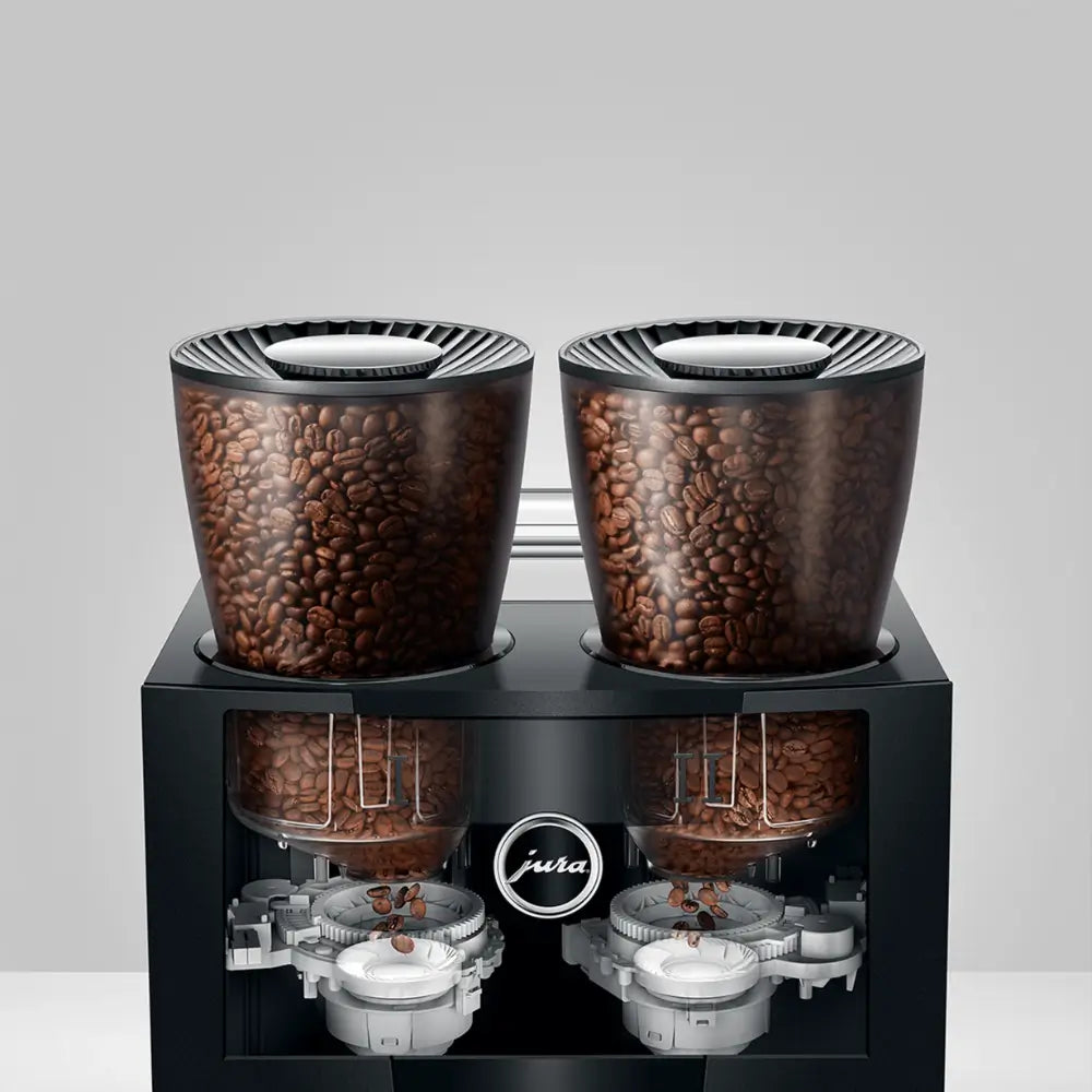 Dual bean hopper system of Jura Giga W10 automatic coffee machine with grinder mechanism visible