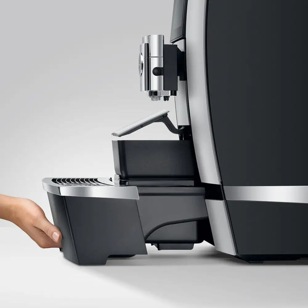 Side view of Jura Giga X3 automatic coffee machine showing drip tray