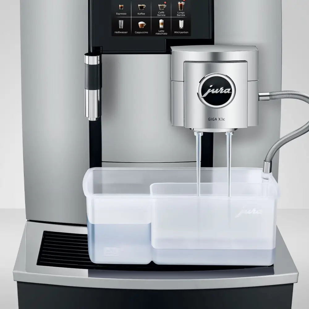 Jura Giga X3c automatic coffee machine performing cleaning process with rinsing container attached