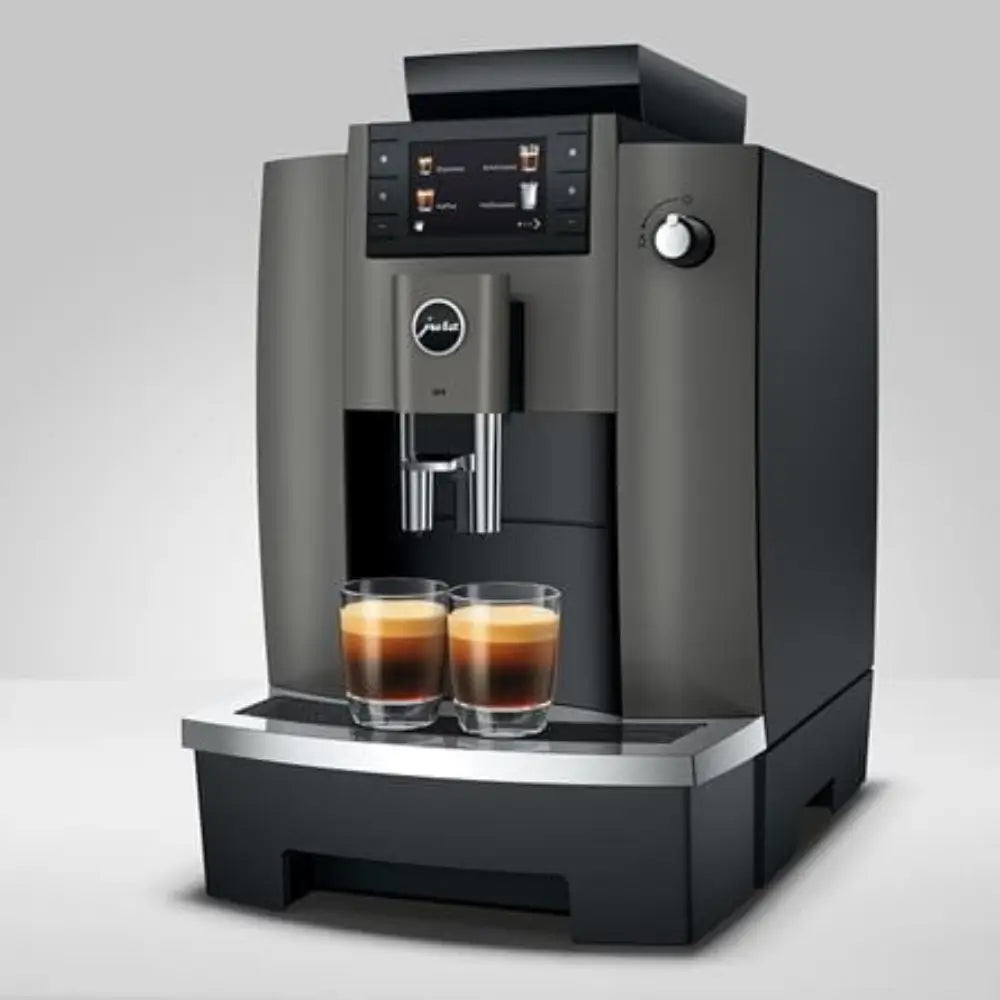 Angled view of the Jura W4 bean-to-cup machine with touchscreen display.