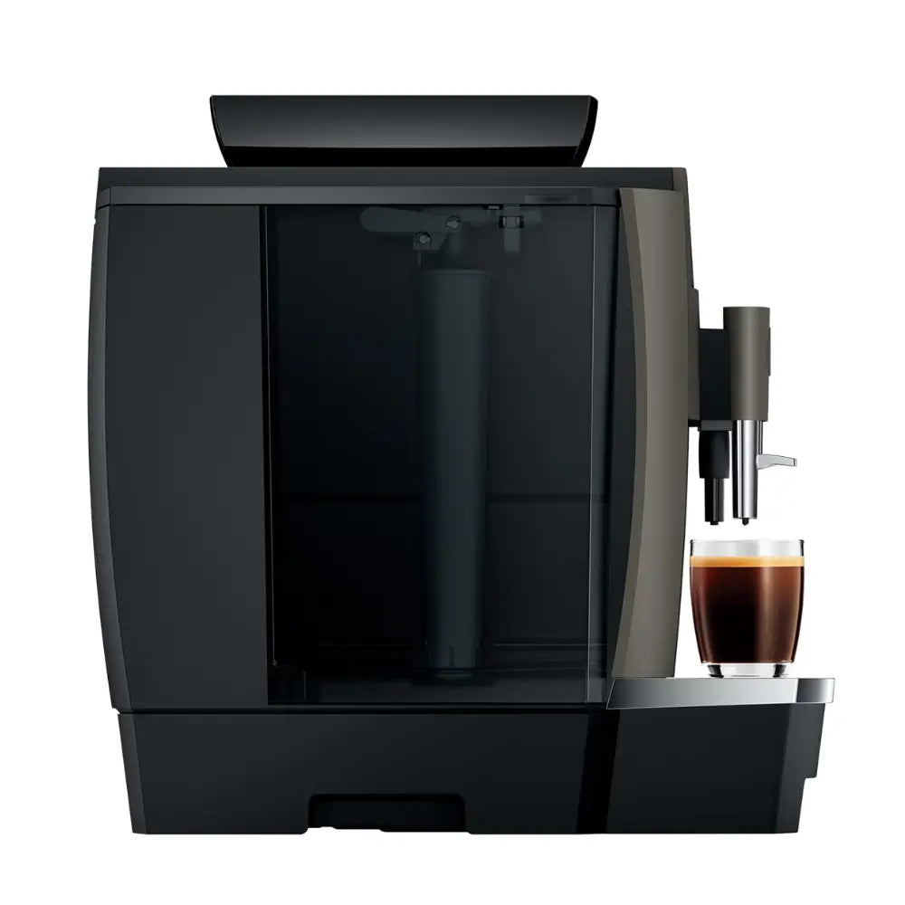 Side view of the Jura W4 machine, showing the integrated water tank and single espresso shot.