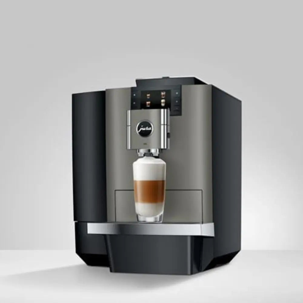 Jura X10c professional coffee machine brewing a latte macchiato.