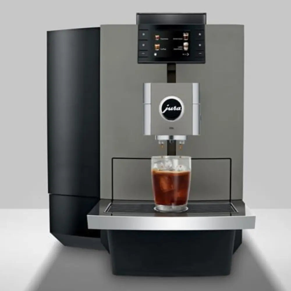 Jura X10c bean-to-cup coffee machine brewing iced coffee into a glass.