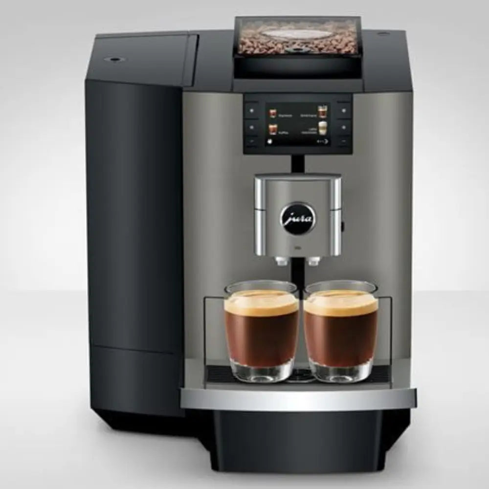 Jura X10c bean-to-cup coffee machine brewing two espressos.