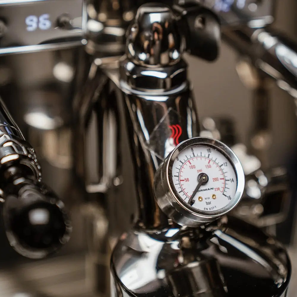 Extreme close-up of the brew group pressure gauge on the La Pavoni Botticelli Specialty machine.