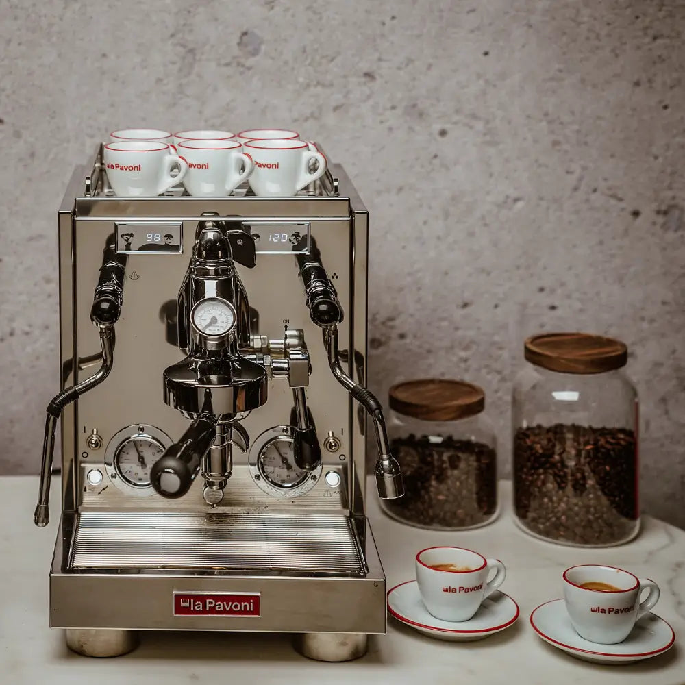 La Pavoni Botticelli Specialty machine on a home counter with espresso cups and accessories.