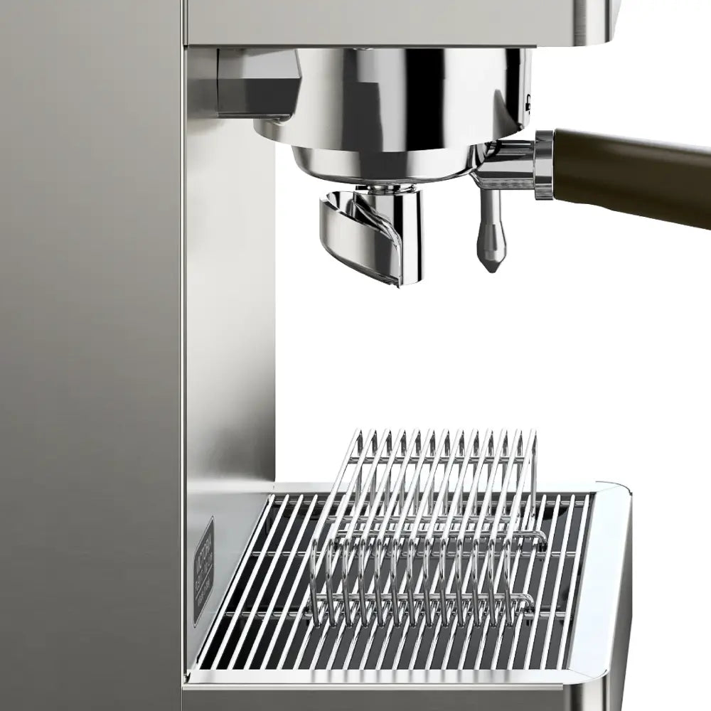 A close-up view of the brew group, portafilter, and removable stainless steel drip tray on the Lelit Victoria espresso machine.