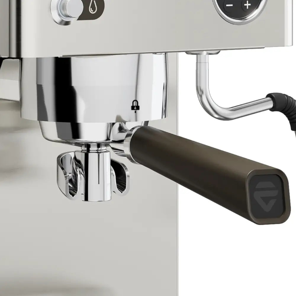 Detailed view of the portafilter locked into the grouphead of the Lelit Victoria espresso machine.