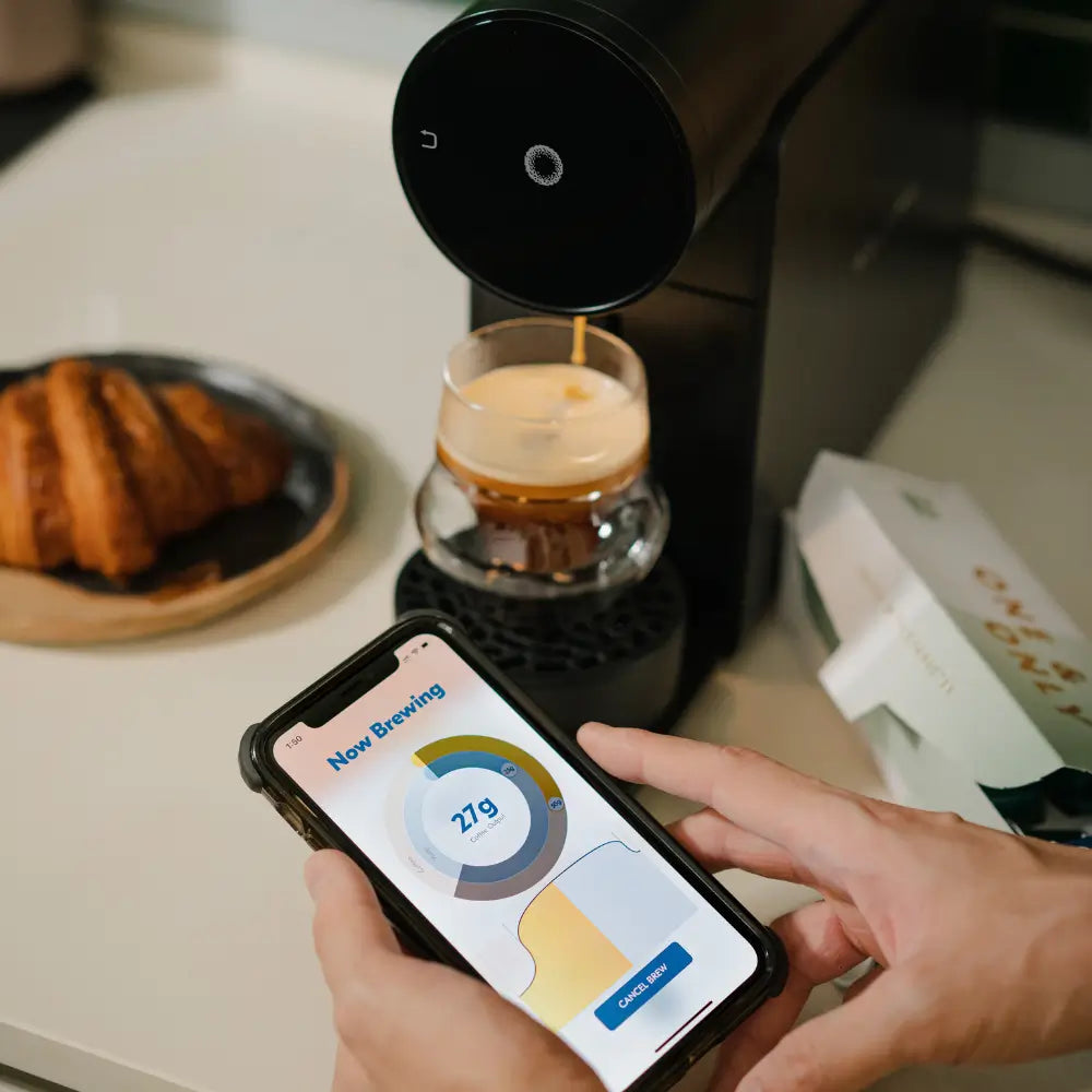 Morning Coffee Machine 220v in black brewing coffee, shown with mobile app control.