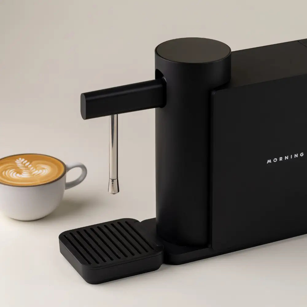 Morning Dream Milk Steamer with a freshly made cappuccino beside it.