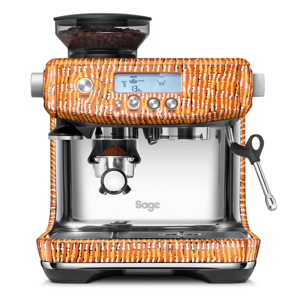 Front view of the Sage Barista Pro integrated espresso machine in a limited edition orange and yellow patterned finish.