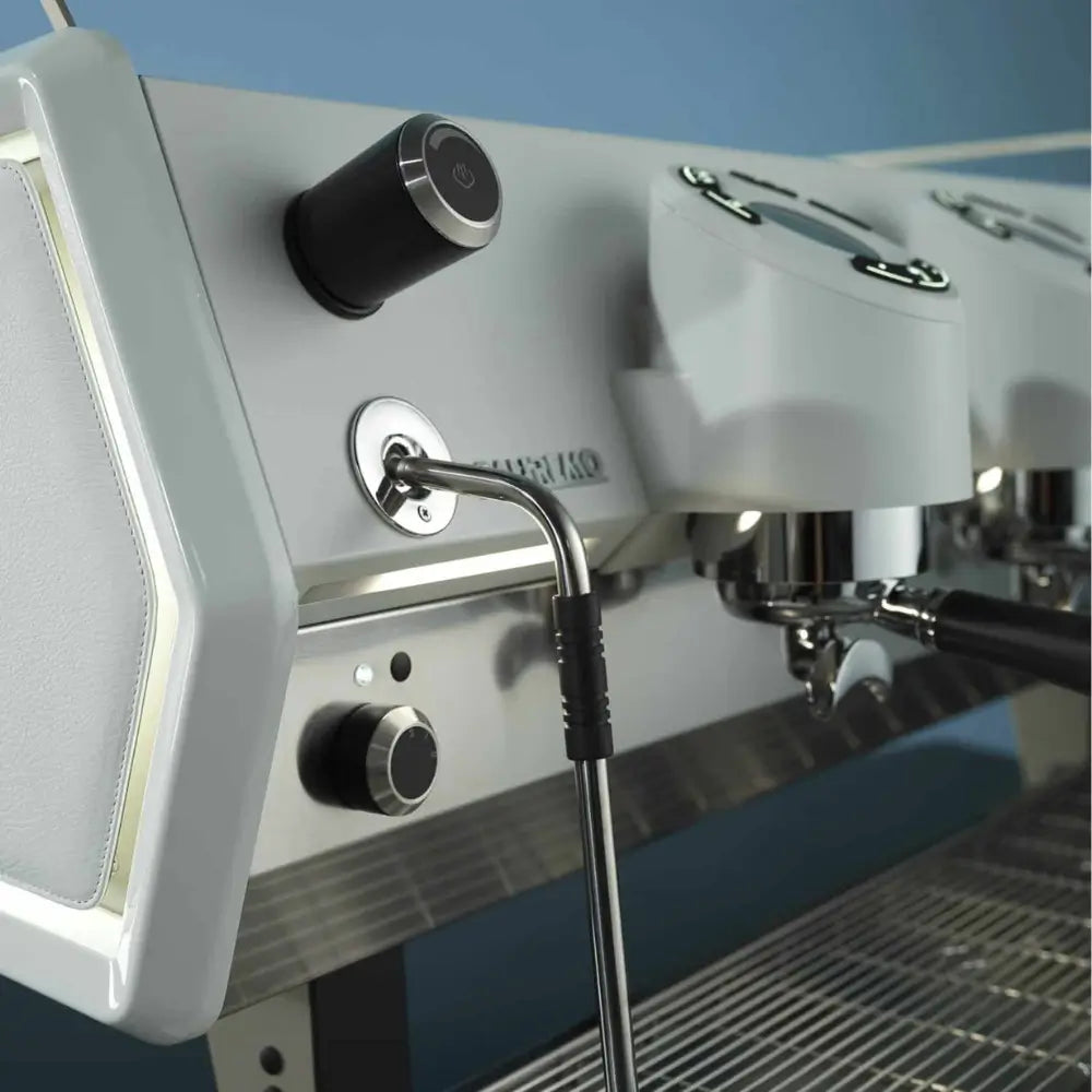 Close-up of the Sanremo D8 Pro's steam wand and the rotary controls on the machine's side panel.