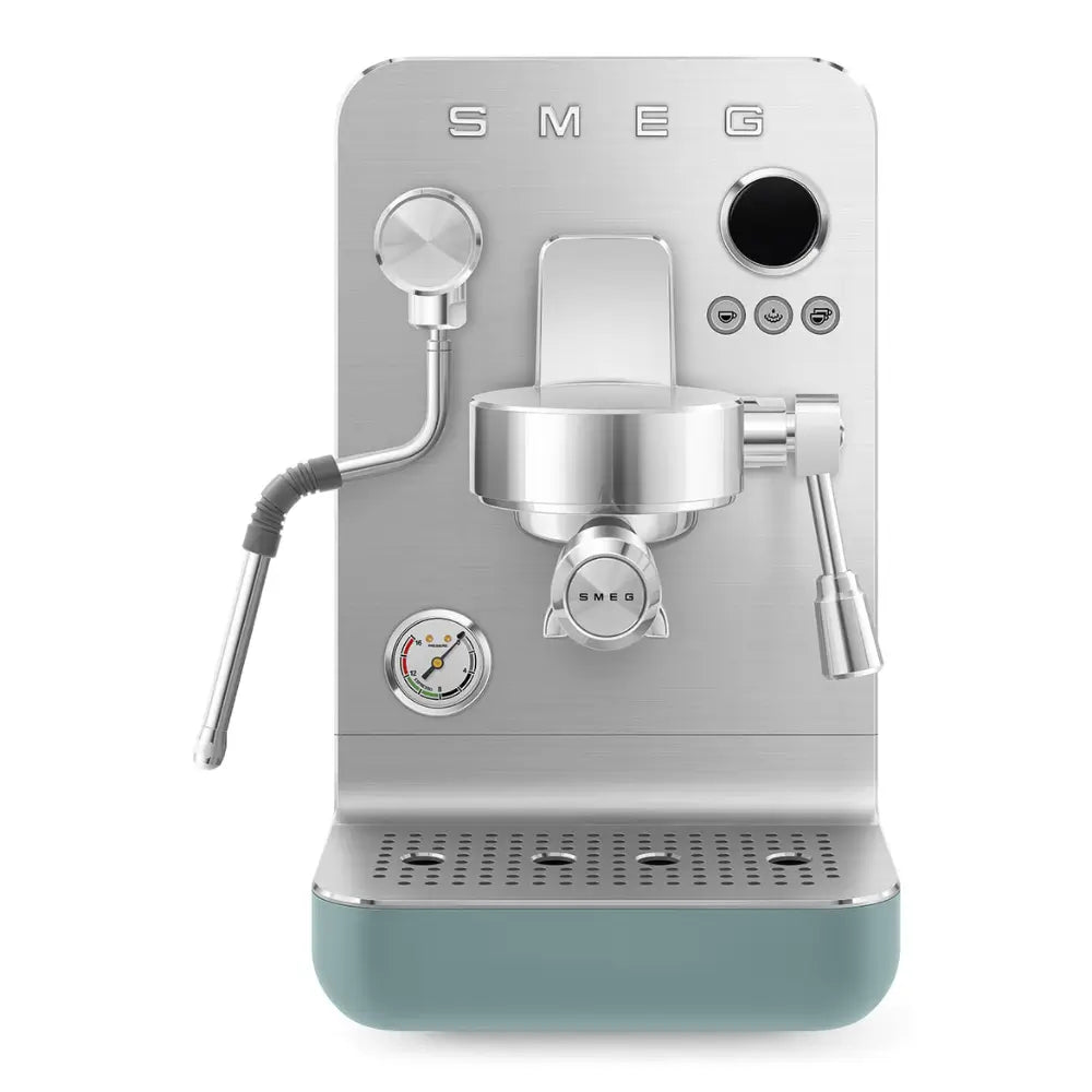 Front view of the SMEG Collezione Minipro espresso machine in silver and emerald green with a pressure gauge.