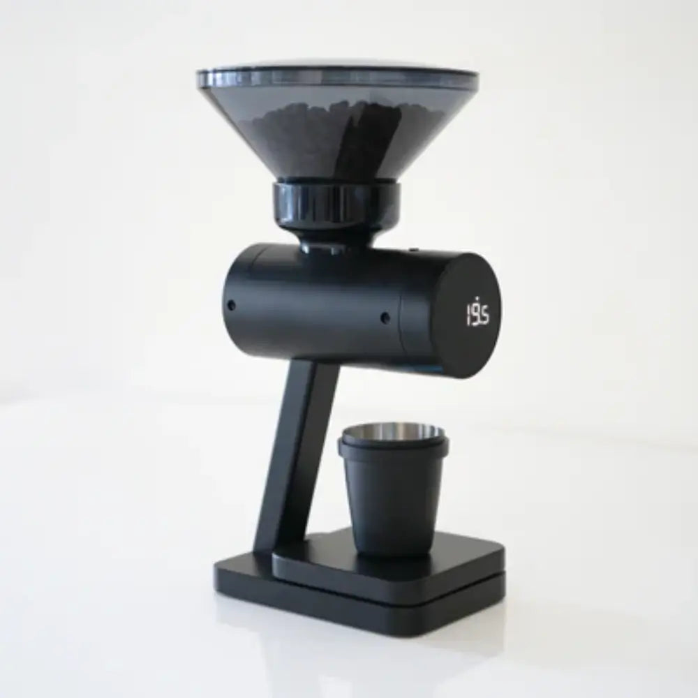 Acaia Orion Nano coffee bean doser in black with beans inside the hopper and stainless steel dosing cup below.