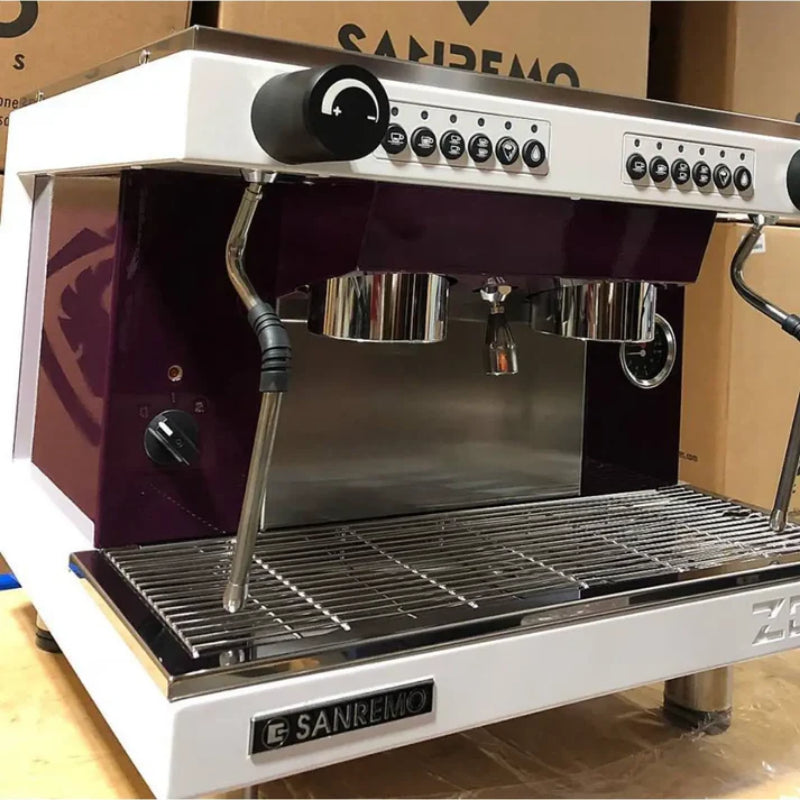 Angled view of the Sanremo Zoe Kompact commercial espresso machine in a white finish.