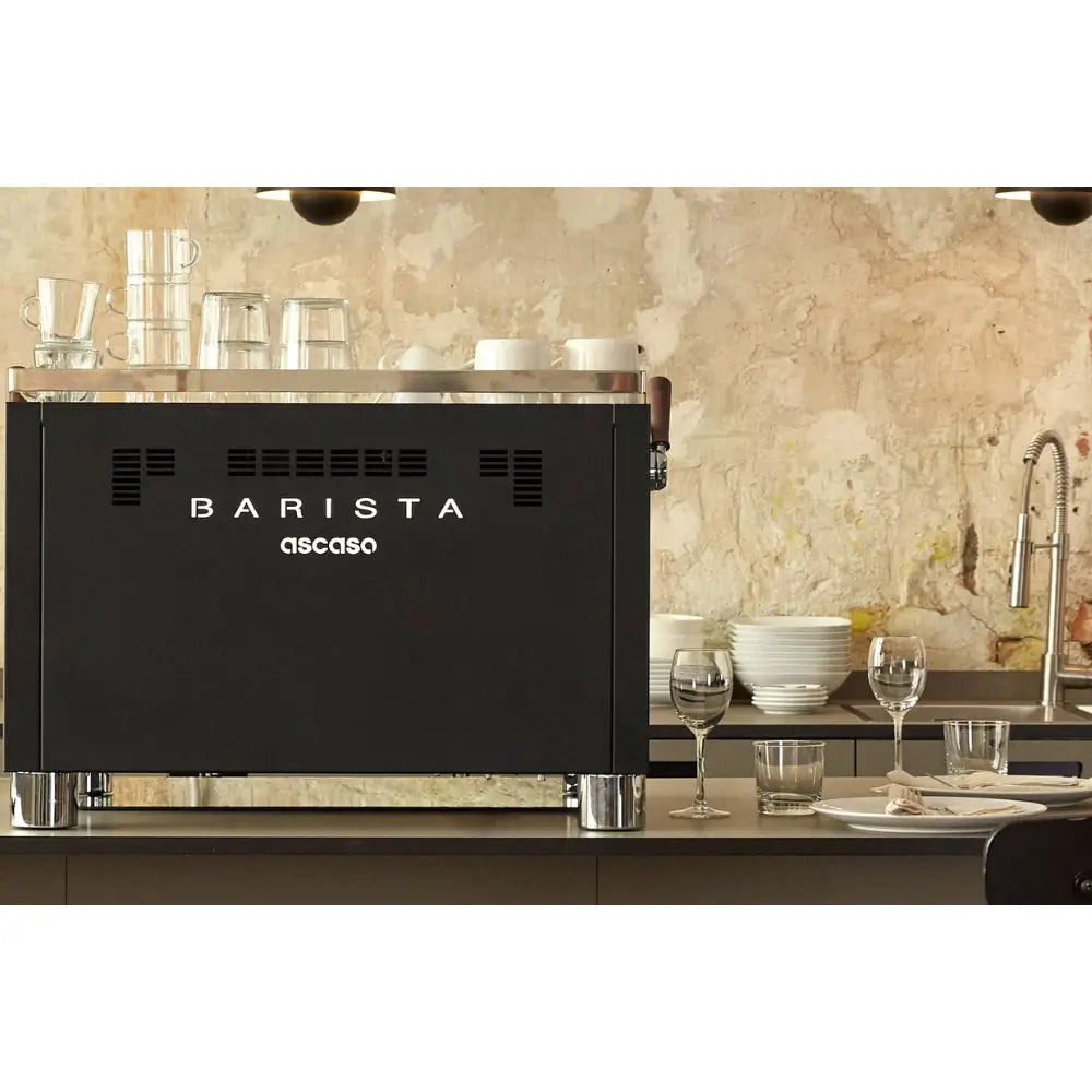 Rear view of the Ascaso Barista T Pro 2 Group espresso machine showing the Barista logo in a restaurant setting.