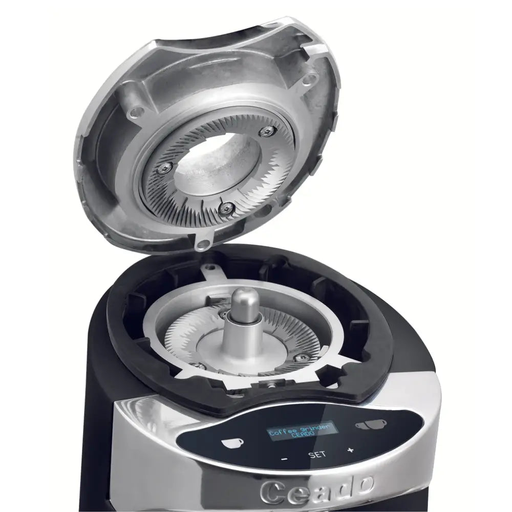 Open grinding chamber of the Ceado E37SL revealing the 83mm flat burrs and easy access for cleaning and maintenance.