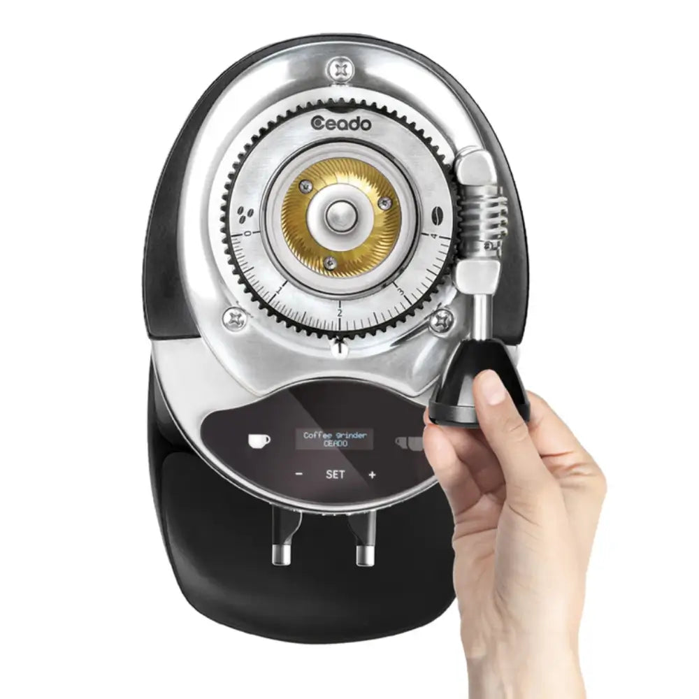 Top-down view of the Ceado E37T showing the gold titanium-coated flat burrs and the Quick Set worm gear adjustment mechanism.