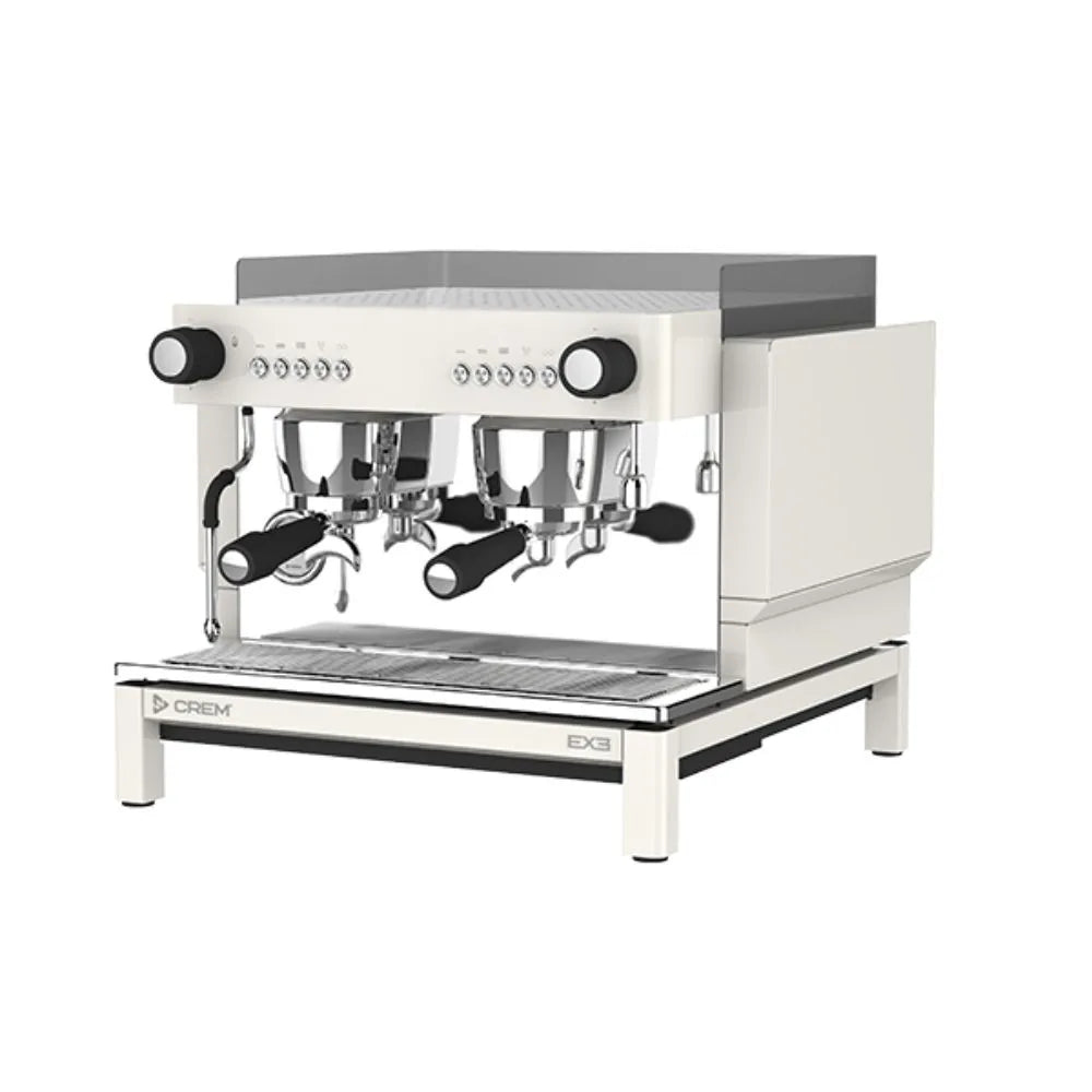 Angled view of the CREM EX3 2 Group Compact Mini Espresso Machine with group heads, steam wand and controls