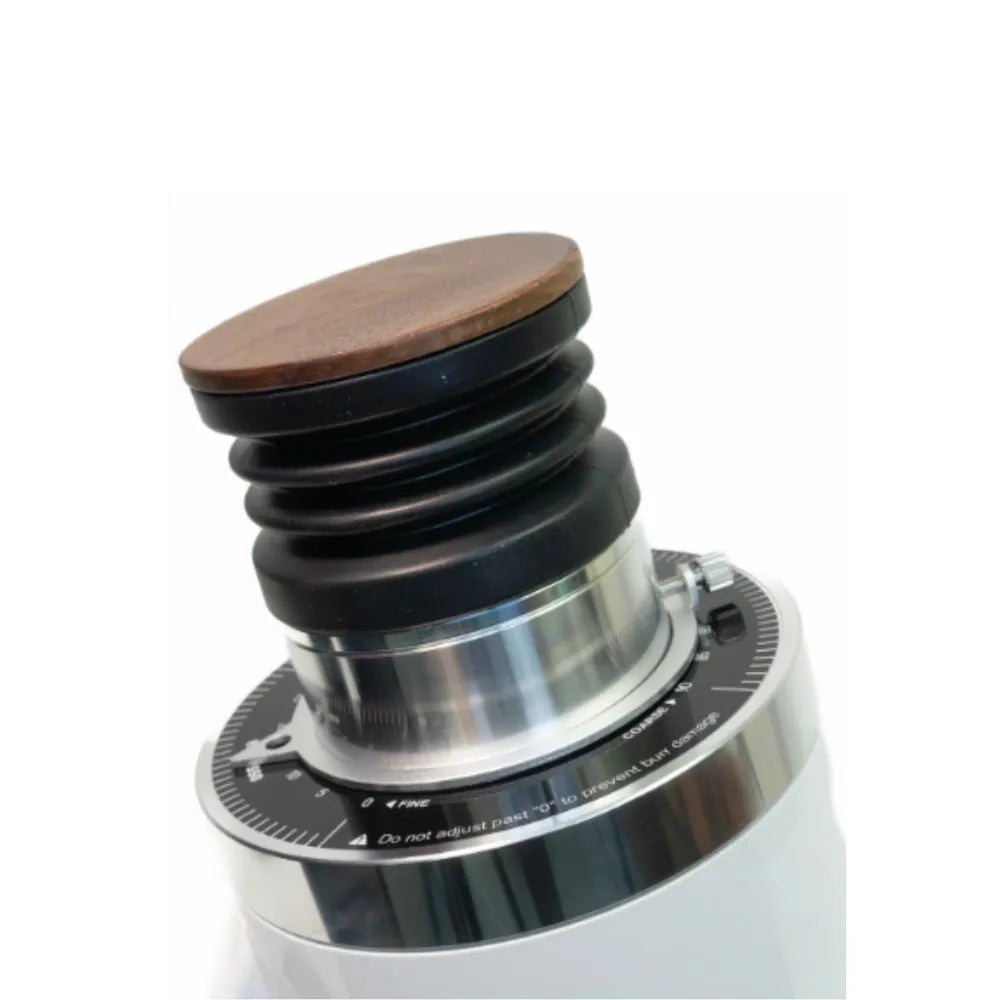 Close-up of DF64 Gen 2 coffee grinder showing wooden lid, bellows, and grind size adjustment collar in white