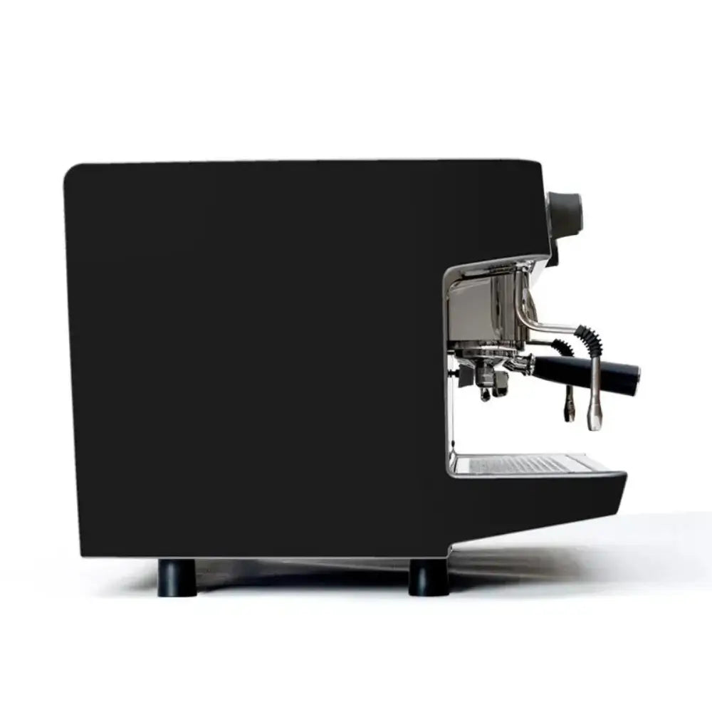 Side profile of the black Iberital Lanna Intenz commercial espresso machine, showing the minimal design and group head.