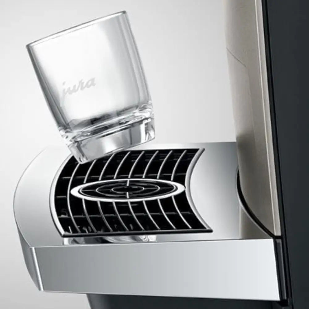 Jura X10c coffee machine drip tray with branded glass.