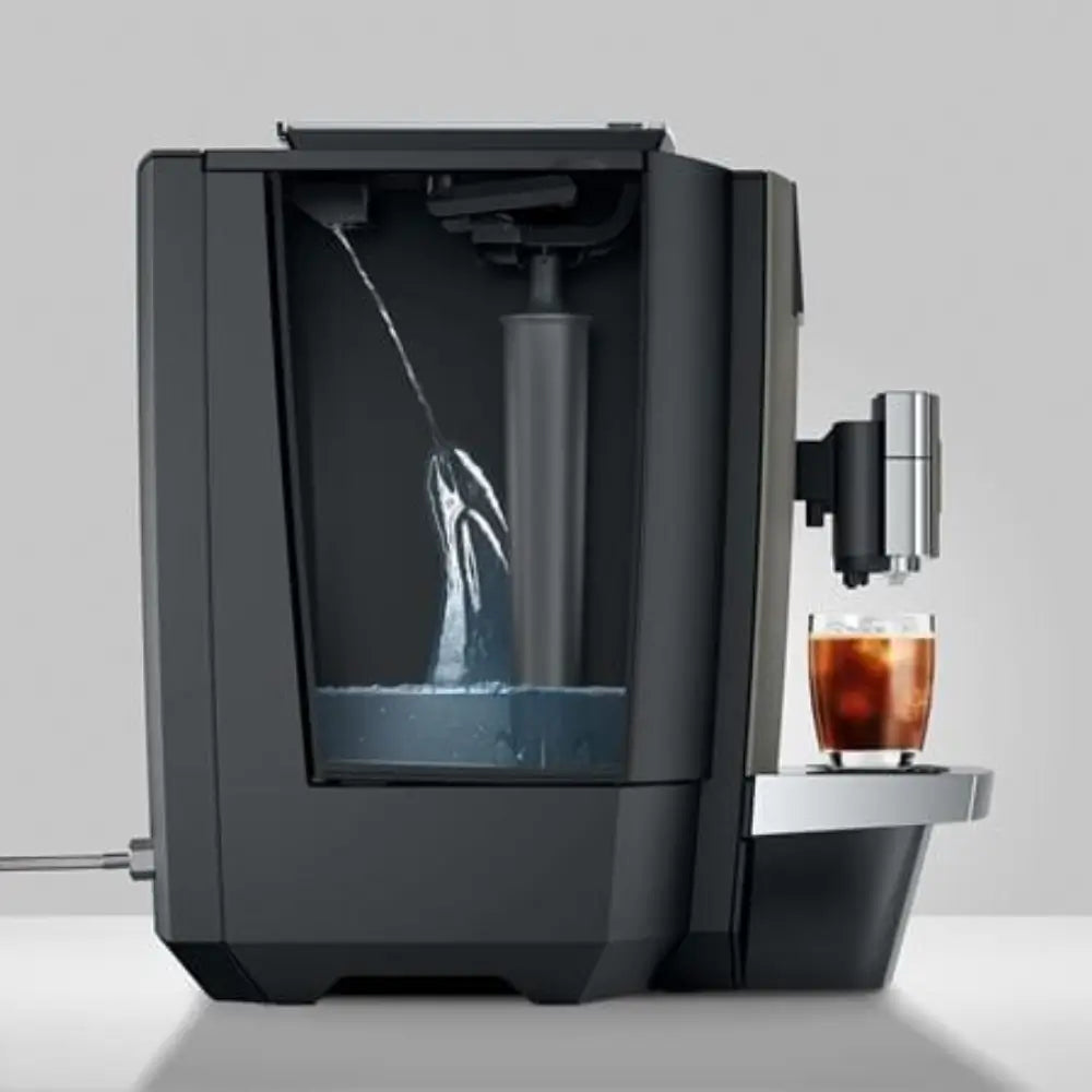 Jura X10c coffee machine with side view of water tank being filled.