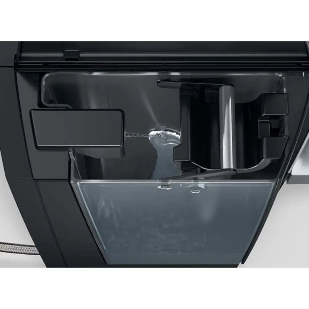 Jura X10c coffee machine close-up of water tank being filled.