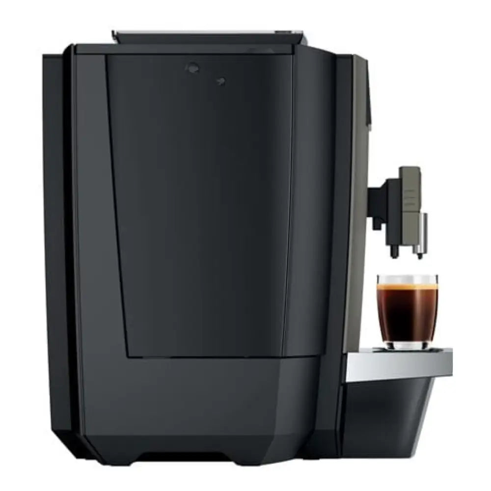 Side profile of the Jura X4 bean-to-cup coffee machine dispensing coffee.