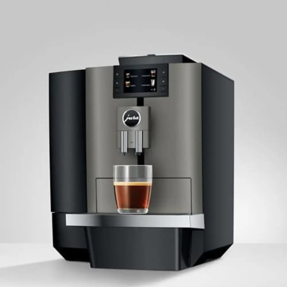 Front view of the Jura X4 bean-to-cup coffee machine dispensing a single coffee.
