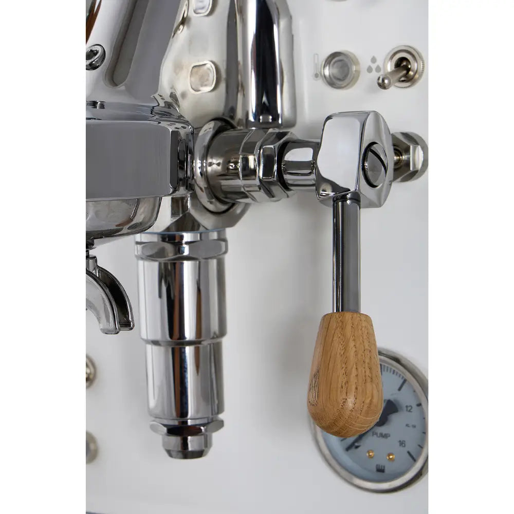 Close-up of the wooden-handled E61-style brew lever on the white La Pavoni Cellini Evolution espresso machine.