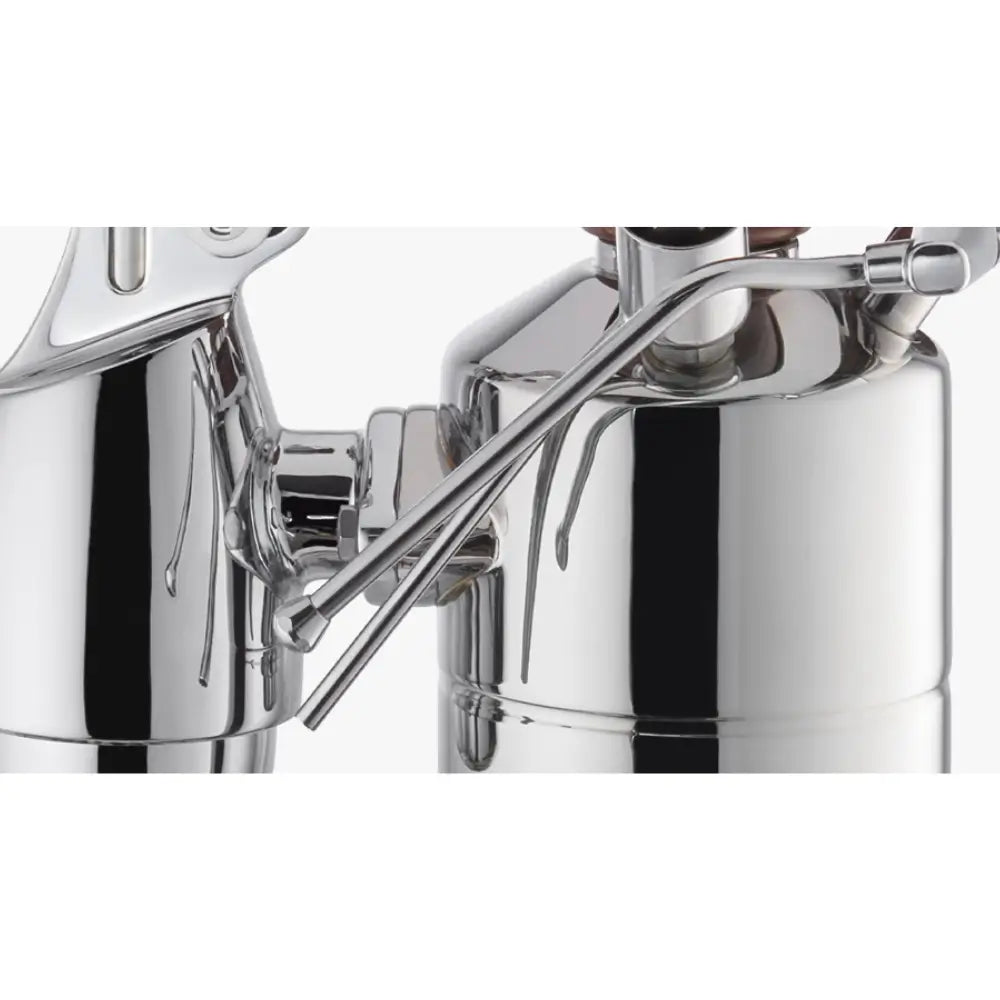 A close-up of the steam wand and the polished chrome boiler of the La Pavoni Esperto Abile lever espresso machine.