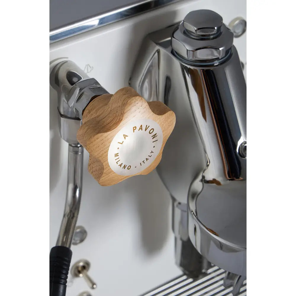 Close-up of the wooden star-shaped valve knob on the white La Pavoni Mini Cellini.