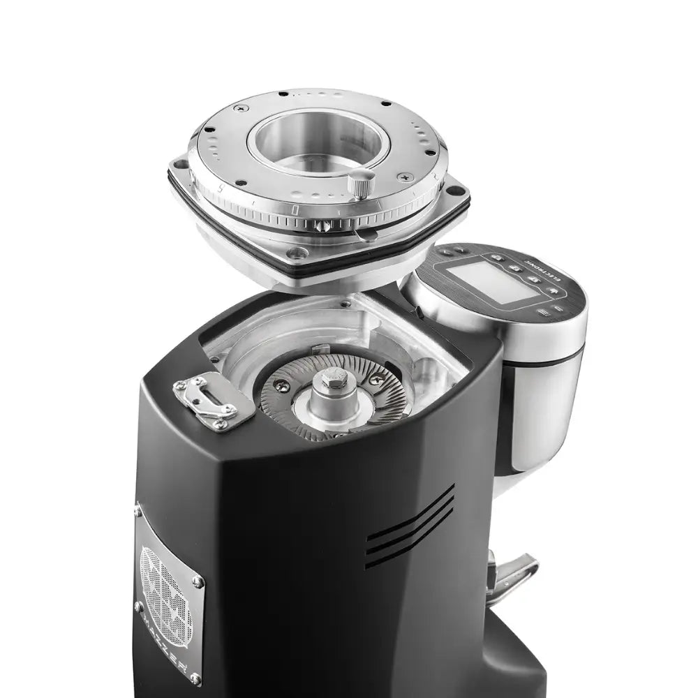 Close-up of Mazzer Major V Electronic grinder with burrs exposed for cleaning and adjustment