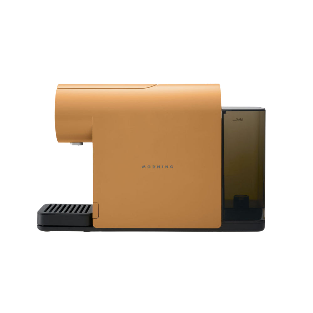 Side view of the Morning Mini Coffee Machine 220v in apricot with water tank attached.
