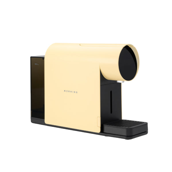Angled view of the Morning Mini Coffee Machine 220v in dawn with water tank attached.