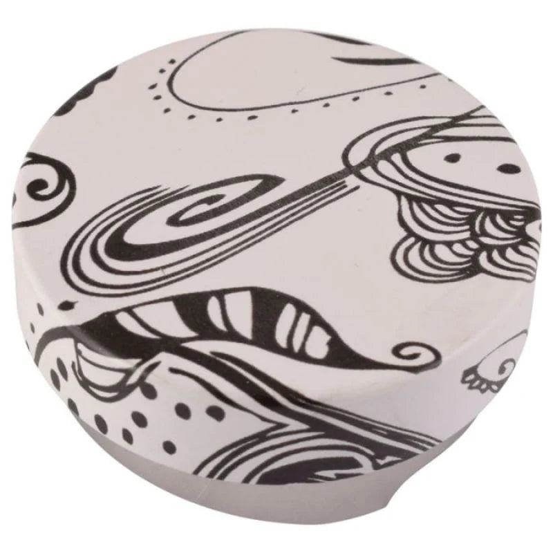 Top view of the Motta 58mm coffee levelling tool with black and white artistic pattern