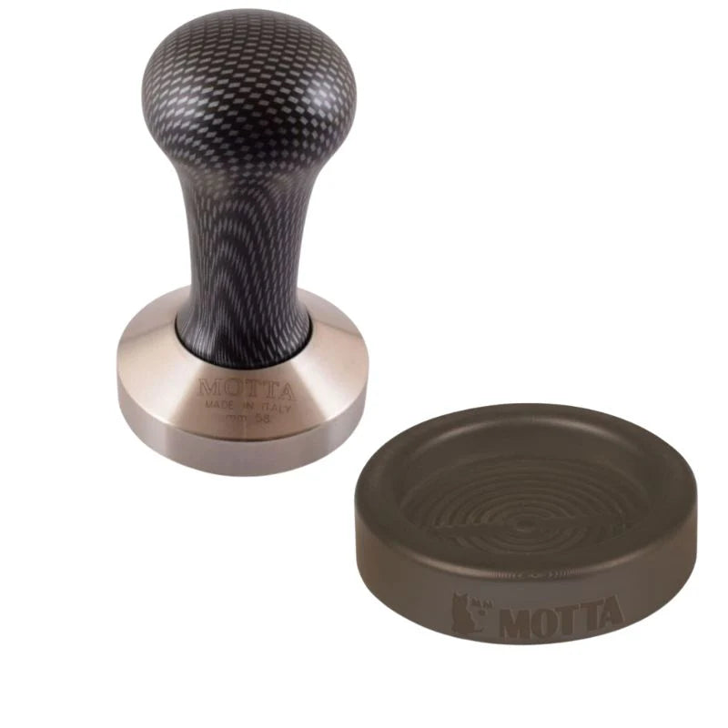 Motta 58mm coffee tamper with carbon-patterned handle and matching rubber holder